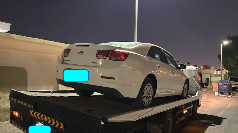 Sedan being loaded onto a recovery truck in Dasman, Sharjah