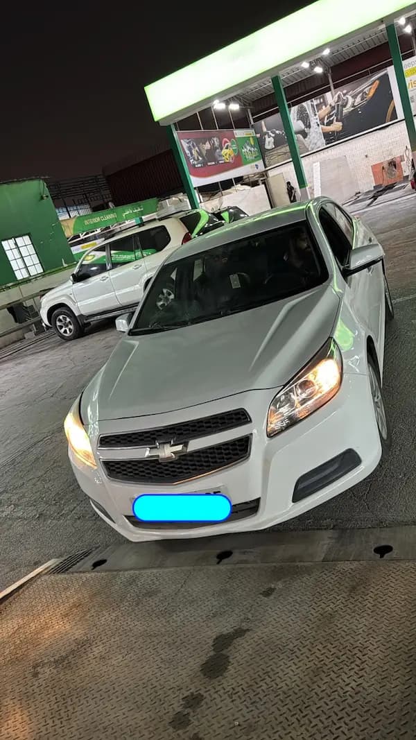 White Chevrolet sedan after delivery at the drop-off point in Industrial Area 5, Sharjah