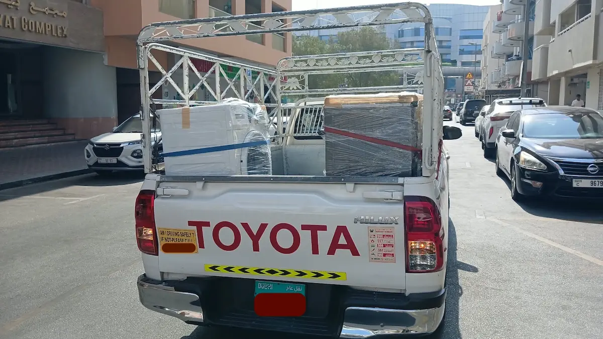 Washing machine and cooker prepared for pickup truck delivery from Dubai to Abu Dhabi